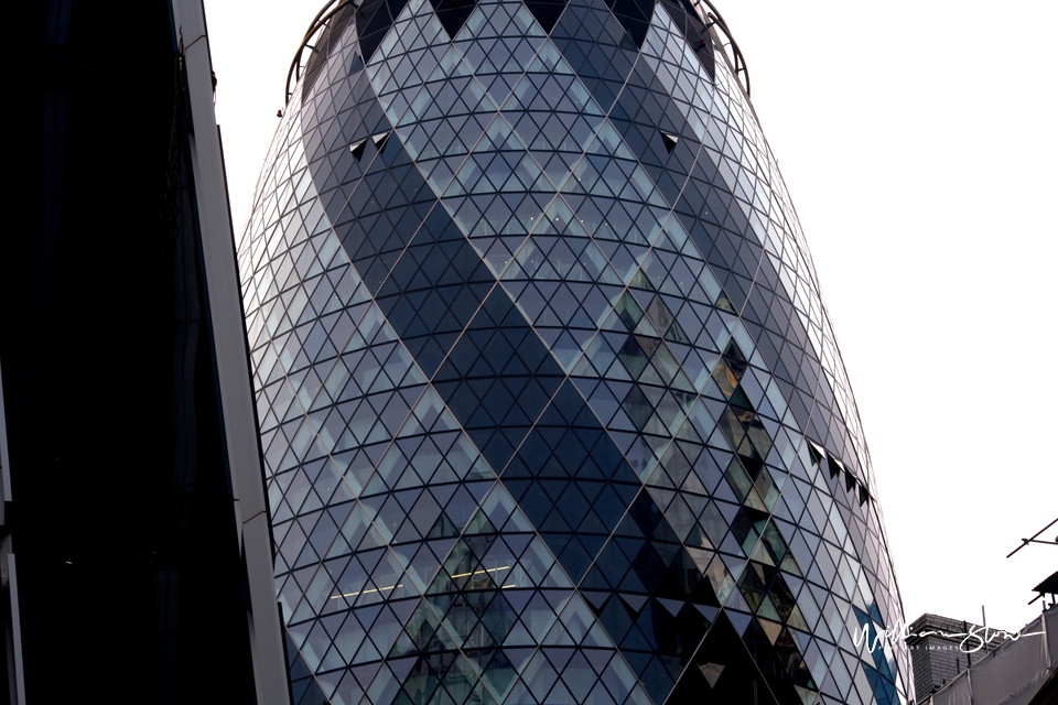 Fine Art, Limited Edition Caramel building looking msall near a new tall building, City of London